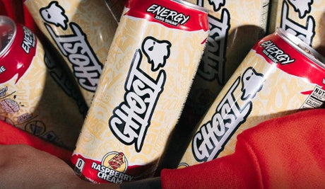 Stack of GHOST Energy Raspberry Cream cans, showcasing the smooth raspberry and cream swirl design, ready-to-drink format.