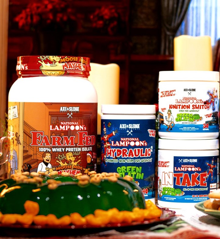 A collection of Axe & Sledge "Christmas Vacation" series supplements, featuring the Farm Fed Squirrel Nut and Moose Mug Mayhem proteins, and the Green Gelatin Mold Ignition Switch, Intake, and Hydraulic pre-workouts.