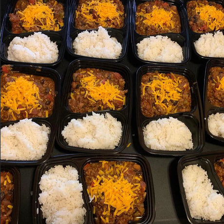 Turkey Chili with a side of Rice and topped with Shredded Cheddar Cheese.